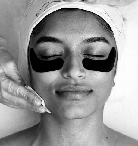 showing eye peel patches applied to under the eyes and applying product