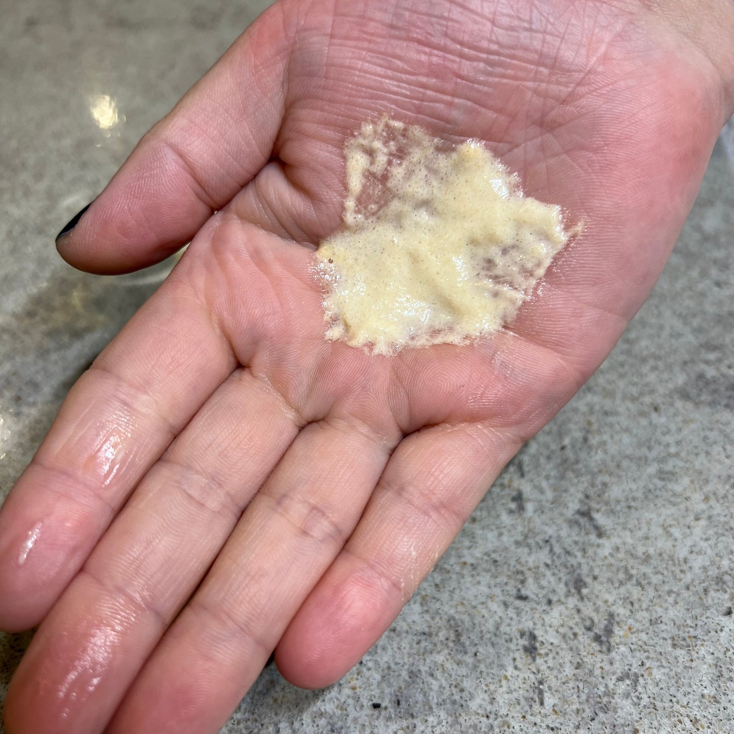 dermalogica daily milkfoliant exfoliating powder on hand